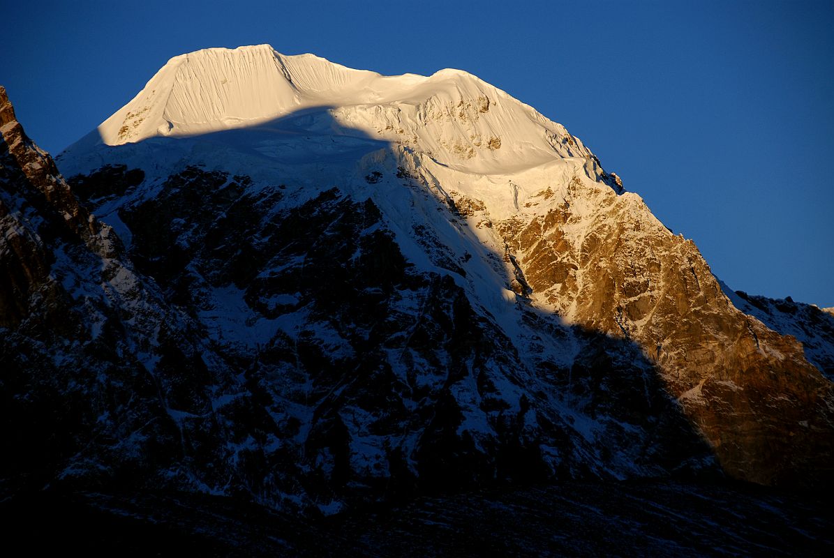 28 Gur Karpo Ri Sunrise From Valley Junction To Kong Tso Above Drakpochen Gur Karpo Ri (6889m) shines at sunrise from the valley junction to Kong Tso above Drakpochen. Gur Karpo Ri was climbed for the first time on November 1, 2007 by Paolo Grobel, Pierre-Oliver Dupuy, Marc Kia and Jean Francois Males via the west ridge from the Nepalese side.